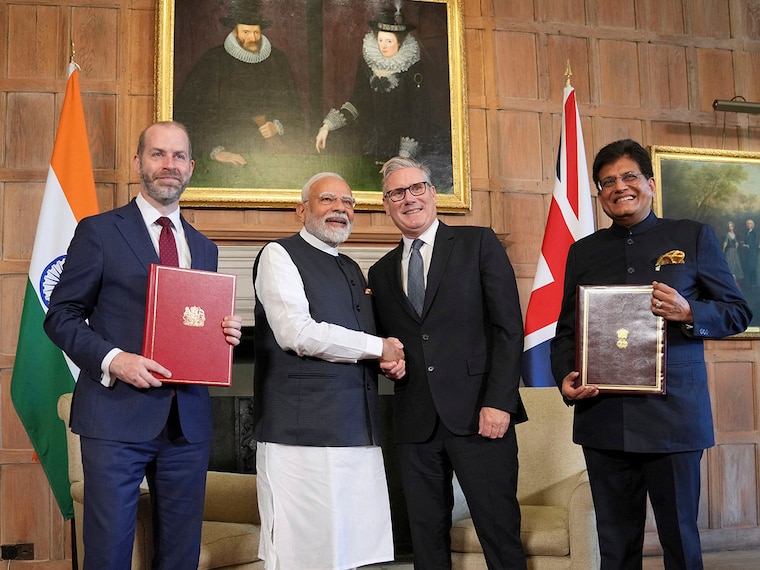 Britain"s Prime Minister Keir Starmer and Prime Minister Narendra Modi of India shake hands after Britain"s Secretary of State for Business and Trade, Jonathan Reynolds, left, and Piyush Goyal, Minister of Industry and Supply of India, right, signed a free trade agreement at Chequers on July 24, 2025, in Aylesbury, England. The deal — the most significant trade pact made by the UK since Brexit, and for India, the first it has signed outside Asia — will still need to be approved by the British parliament and India"s federal cabinet, which is expected to take place within a year.