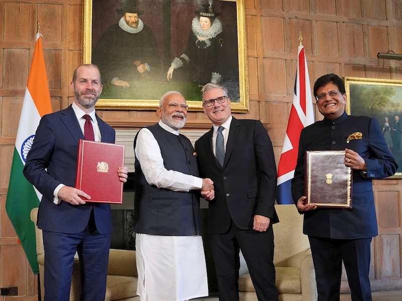 Britain"s Prime Minister Keir Starmer and Prime Minister Narendra Modi of India shake hands after Britain"s Secretary of State for Business and Trade, Jonathan Reynolds, left, and Piyush Goyal, Minister of Industry and Supply of India, right, signed a free trade agreement at Chequers on July 24, 2025, in Aylesbury, England. The deal — the most significant trade pact made by the UK since Brexit, and for India, the first it has signed outside Asia — will still need to be approved by the British parliament and India"s federal cabinet, which is expected to take place within a year.