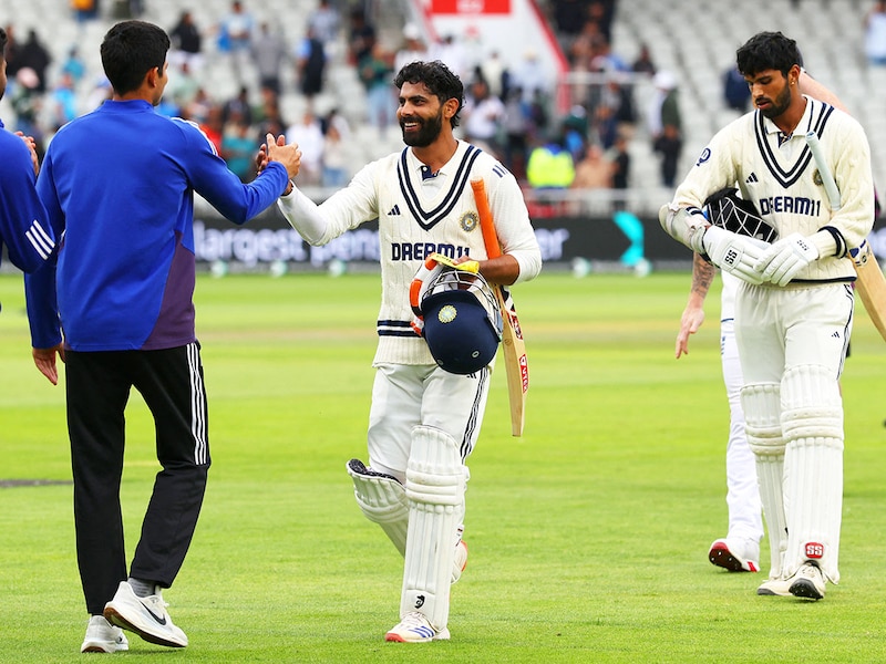 India"s Ravindra Jadeja (2nd R) and India"s Washington Sundar (R) leave the field after drawing the match on day five of the fourth cricket test match between England and India at Old Trafford, in Manchester, north England, on July 27, 2025.