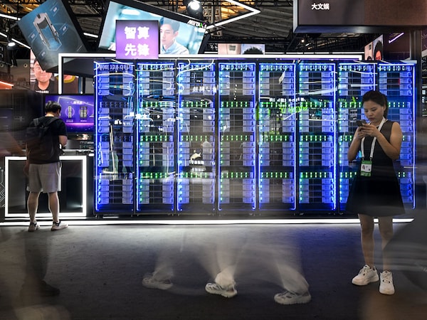 A long exposure shows people visiting the World Artificial Intelligence Conference (WAIC) at the Shanghai World Expo and Convention Center in Shanghai on July 28, 2025.
Image: Hector Retamal / AFP
