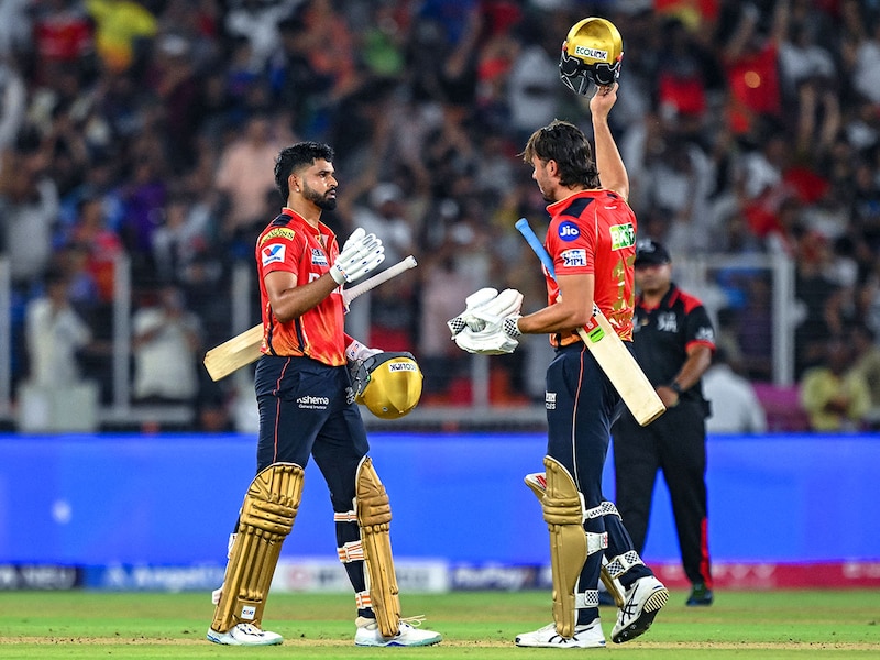 Punjab Kings" captain Shreyas Iyer (L) and his teammate Marcus Stoinis celebrate their team"s win in the Indian Premier League (IPL) Twenty20 second qualifier cricket match between Punjab Kings and Mumbai Indians at the Narendra Modi Stadium in Ahmedabad on June 2, 2025.