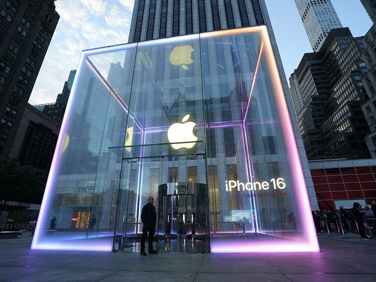 (File) Customers wait outside at the Fifth Avenue Apple Store in New York City. Apple announced at the launch of iPhone 16 that iPhone is built for generative artificial intelligence as it seeks to boost sales and show it is keeping up in the technology race. 
Image: Timothy A> Clary / AFP