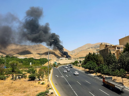 Smoke billows for the second day from the Shahran oil depot, northwest of Tehran, on June 16, 2025. Iran unleashed a barrage of missile strikes on Israeli cities early on June 16, after Israel struck military targets deep inside Iran, with both sides threatening further devastation.
Image: AFP