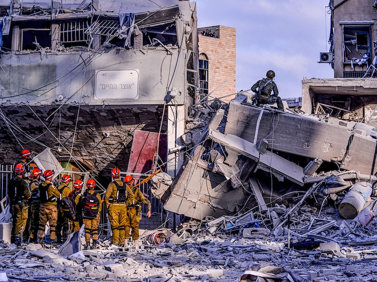 IDF Home Front Command and Medics are looking for casualties in a private house destroyed by a direct hit in Bnei Brak following an Iranian ballistic missile barrage towards Israel. Israel launched a sweeping assault on the heart of Iran"s nuclear and military structure, deploying warplanes and drones previously smuggled into the country to strike key facilities and kill top generals and scientists, a barrage it said was necessary before its adversary got any closer to building an atomic weapon. Iran retaliates by unleashing scores of ballistic missiles on Israel, where explosions flared in the skies over Jerusalem and Tel Aviv and shook the buildings below.