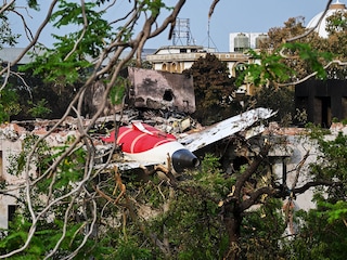 Wreckage showing the tail section of the Air India Boeing 787-8 is pictured in a residential area near the airport in Ahmedabad on June 14, 2025,  Investigators recovered a black box recorder on June 13 from the crash site of a London-bound passenger jet that ploughed into a residential area of India"s Ahmedabad city. 
Image: Punit Parankjpe / AFP