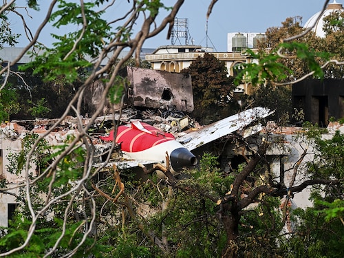 Wreckage showing the tail section of the Air India Boeing 787-8 is pictured in a residential area near the airport in Ahmedabad on June 14, 2025, Investigators recovered a black box recorder on June 13 from the crash site of a London-bound passenger jet that ploughed into a residential area of India"s Ahmedabad city.
Image: Punit Parankjpe / AFP Wreckage showing the tail section of the Air India Boeing 787-8 is pictured in a residential area near the airport in Ahmedabad on June 14, 2025, Investigators recovered a black box recorder on June 13 from the crash site of a London-bound passenger jet that ploughed into a residential area of India"s Ahmedabad city.
Image: Punit Parankjpe / AFP