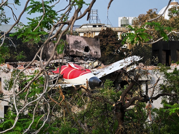 Wreckage showing the tail section of the Air India Boeing 787-8 is pictured in a residential area near the airport in Ahmedabad on June 14, 2025, Investigators recovered a black box recorder on June 13 from the crash site of a London-bound passenger jet that ploughed into a residential area of India"s Ahmedabad city.
Image: Punit Parankjpe / AFP