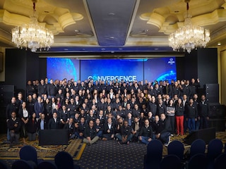 This picture taken on June 18, 2025 shows a woman posing with Labubu (L) and Mokoko characters in an exhibition hall as they visit Pop MartÃ­s theme park Pop Land in Beijing. 
Image: Pedro Pardo / AFP