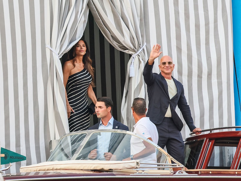 Lauren Sanchez and founder of Amazon, Jeff Bezos, leave the Aman Hotel in Venice on June 25, 2026. Celebrities in superyachts sail into Venice this week for the three-day wedding party of Amazon tycoon Jeff Bezos and Lauren Sanchez, despite irate locals who say the UNESCO city is no billionaire"s playground. The tech magnate and journalist have reportedly invited about 200 guests to their multi-million dollar nuptials in the Italian city, which are expected to kick off on June 26 and end Saturday with a ceremony at a secret location.