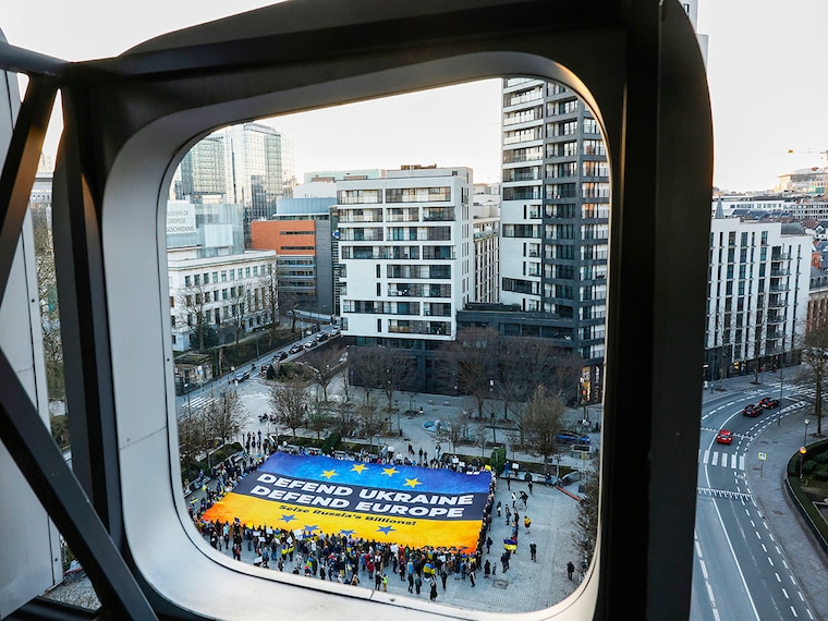 Activists unfurl a large banner in support of Ukraine outside the European Council building ahead of an EU summit in Brussels, Belgium, Wednesday, March 5, 2025.