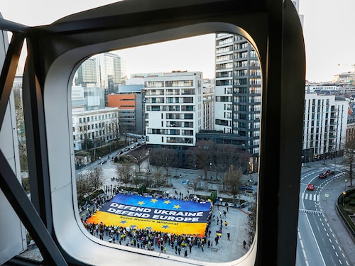 Activists unfurl a large banner in support of Ukraine outside the European Council building ahead of an EU summit in Brussels, Belgium, Wednesday, March 5, 2025.