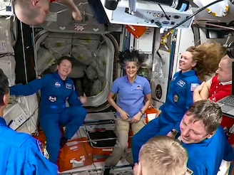 In this screenshot from a NASA video shows Sunita Williams and other astronauts greeting each other after the SpaceX capsule docked with the International Space Station, Sunday, March 16th, 2025.
