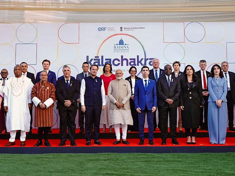 Prime Minister Narendra Modi is seen with US Director of National Intelligence Tulsi Gabbard (front row, second from right), among other distinguished delegates, at the family picture for the 10th edition of the Raisina Dialogue in New Delhi on March 17, 2025. The Raisina Dialogue is India’s premier conference on geopolitics and geoeconomics, committed to addressing the most challenging issues facing the global community today.