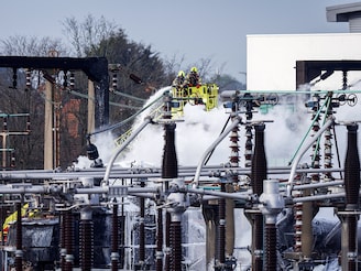 Firefighters douse flames after a fire broke out at a substation supplying power to Heathrow Airport in Hayes, west London, on March 21, 2025. Officials said that Britain"s Heathrow airport, Europe"s busiest, was shut down early on March 21 for 24 hours after a major fire at an electricity substation cut power to the sprawling facility west of London.