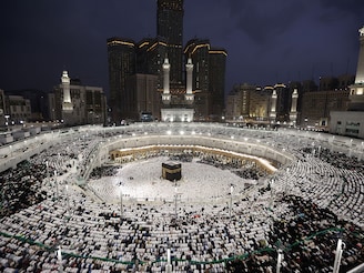 Muslims pray around the Kaaba at the Grand Mosque in the holy city of Mecca on March 26, 2025, on Laylat al-Qadr, or Night of Destiny, one of the holiest nights during the holy fasting month of Ramadan.