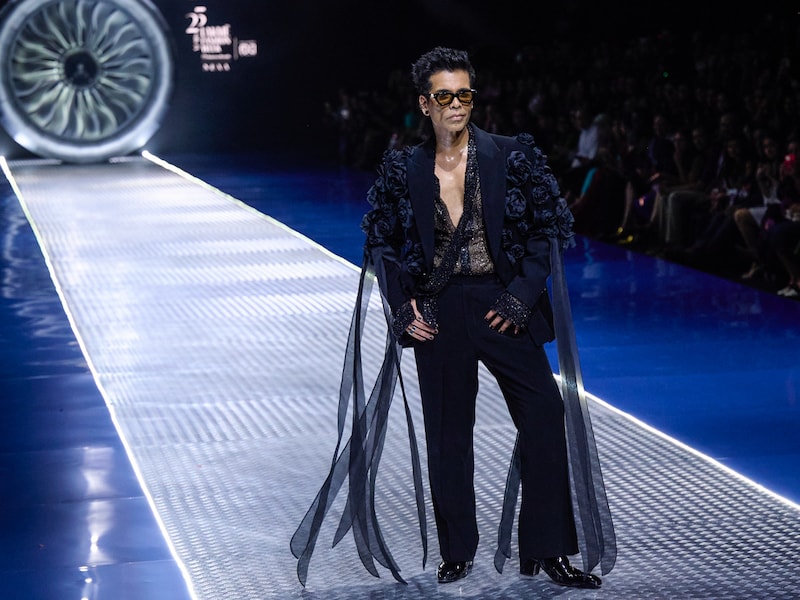 Karan Johar presents a collection by designer duo Falguni and Shane Peacock at the Lakme Fashion week 2025 on March 28, 2025, in Mumbai, India.