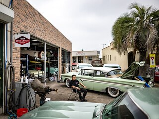 This picture taken on April 25, 2025 shows Yosuke Fukuda, the owner of US car dealer Y-Tech, sitting at his company in Fukaya of Saitama Prefecture. The classic cars on sale at Yosuke Fukuda"s repair yard ooze Californian cool with their chrome and tail fins, but on Japanese roads new US vehicles are a rare sight -- much to President Donald Trump"s annoyance.
Image: Philip Fong / AFP