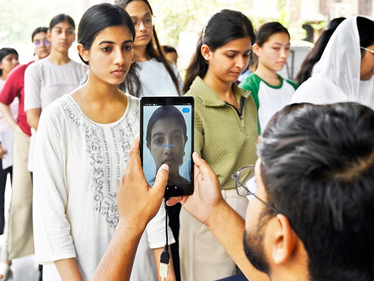 A candidate appearing for the National Eligibility cum Entrance Test (NEET-UG 2025) gets screened at the exam centre in New Delhi, India, on May 5, 2025. The Unique Identification Authority of India (UIDAI) successfully piloted face authentication for NEET UG 2025 at select exam centres, marking a major step in enhancing examination security and ensuring robust candidate verification using advanced biometric technology. This initiative also showcased the potential of Aadhaar face authentication in significantly curbing attempts at impersonation during entrance exams. Image: Sanjeev Verma/HT via Getty Images