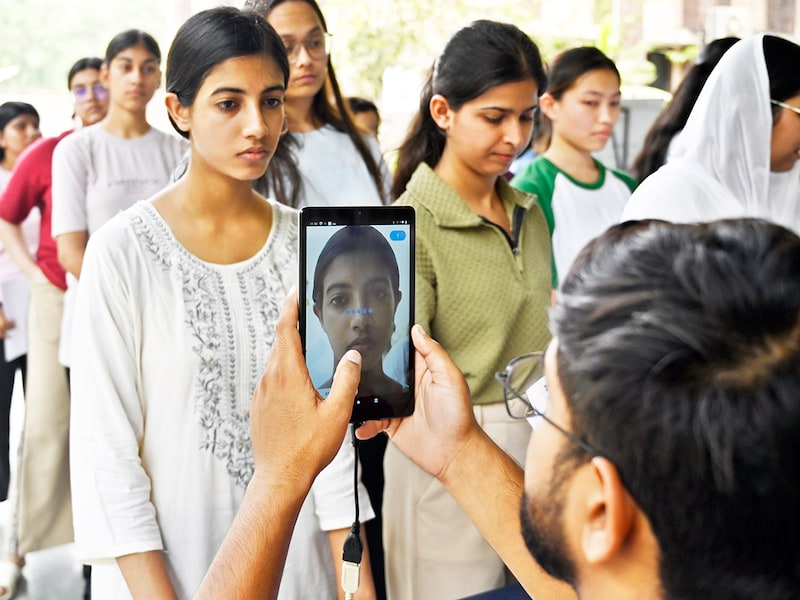 A candidate appearing for the National Eligibility cum Entrance Test (NEET-UG 2025) gets screened at the exam centre in New Delhi, India, on May 5, 2025. The Unique Identification Authority of India (UIDAI) successfully piloted face authentication for NEET UG 2025 at select exam centres, marking a major step in enhancing examination security and ensuring robust candidate verification using advanced biometric technology. This initiative also showcased the potential of Aadhaar face authentication in significantly curbing attempts at impersonation during entrance exams. Image: Sanjeev Verma/HT via Getty Images