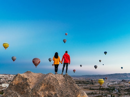 A couple enjoying a panoramic view at Cappadocia in Turkey.
Image: Shutterstock A couple enjoying a panoramic view at Cappadocia in Turkey.
Image: Shutterstock