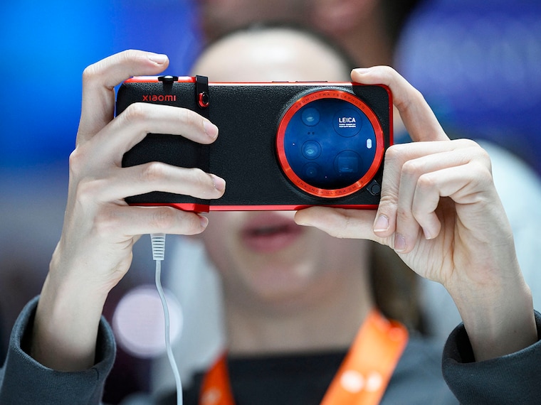 A person uses a Xiaomi smartphone with Leica lenses at the MWC (Mobile World Congress), the world"s biggest mobile fair, in Barcelona on March 5, 2025.
Image: Josep Lago / AFP
