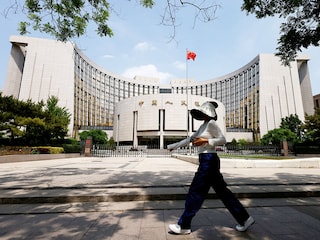 A person walks past the headquarters of the People"s Bank of China, in Beijing, China on May 7, 2025.
Image: Tingshu Wang / Reuters