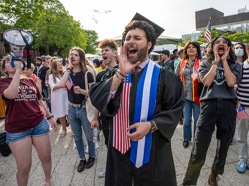 Graduating Harvard students Victor Flores (centre), Avinashi Bhandari (right), and other fellow students gather during the Harvard Students for Freedom rally in support of international students, at the Harvard University campus in Boston, Massachusetts, on May 27, 2025. The Trump administration has intensified its fight with Harvard University, trying to halt the university"s ability to enrol international students, while getting ready to cancel the federal government"s remaining contracts with the University — worth an estimated $100 million.