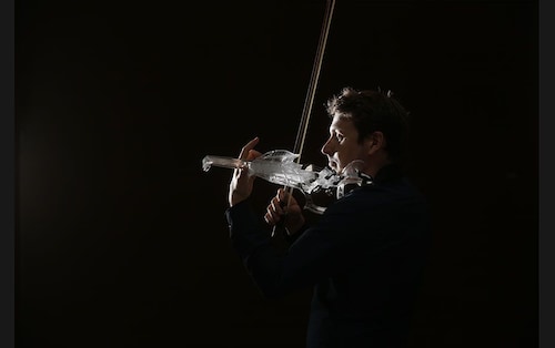  French engineer and professional violinist Laurent Bernadac plays the &quot3Dvarius&quot, a 3D printed violin made of transparent resin, in Paris, France, on September 11 <br />