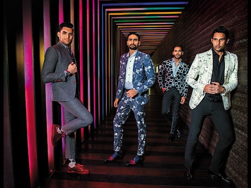 <strong>Style:</strong> Unconventional suits: Old school with a modern twist. <br /><strong>In focus:</strong> High-gloss footwear for the urban man.<br /><br />(From left to right)<br />Textured three-piece suit with red buttons on the jacket and red buttonholes on the waistcoat by Sunil Mehra. Shirt with coloured piping by Wills Lifestyle. Red glossy shoes by Christian Louboutin. Watch by Swiss Military.<br />Graphic-printed jacket by Ashish Soni. Plain black shirt by Surbhi Pansari. Glossy laced shoes by Azzurro. Watch by Maserati.<br />Playing card-printed jacket by SavilRoez Bespoke. Grey shirt by West Street. Laceless shoes by Tresmode. Watch by Jacques Lemans.<br />Floral suit by Varun Bahl. Dual-panel shirt by Camessi. Shoes by Alberto Torresi. Watch by Vacheron Constantin.<br /><br /><br /><strong>Hair &amp Grooming: </strong><br /><strong>Y&ampE STYLE MEDIA PVT LTD</strong><br />Styling Assistant: UDIT RANA<br />Production: Y&ampE STYLE MEDIA PVT LTD.<br />Production coordinator: <br />SAHIL VIG &amp KAMAL KUMAR<br />Models: NAVNIT SHARMA, JAGGY SINGH, ADITYA KUNDRA &amp OJAS MALLA<br />Location &amp Hospitality: <br />THE LEELA AMBIENCE, GURGAON HOTEL &amp RESIDENCES<br />( )                        <br /><br />                        