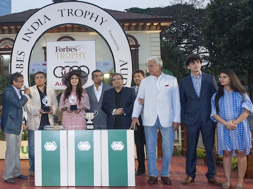 (L to R) Vivek Jain (Chairman, RWITC), Joy Chakraborthy (CEO - <em>Forbes India</em> and President-Revenue, Network18 News) Nisha Jamvwal (Columnist, Luxury brand consultant and Interior Architect) Abbey Thomas (Marketing Head Audi India) Sourav Majumdar (Editor, <em>Forbes India</em>) Jaydev M Mody of J.M. Livestock Pvt Ltd and his family at the prize distribution ceremony of the Forbes India Trophy 2017 (L to R) Vivek Jain (Chairman, RWITC), Joy Chakraborthy (CEO - <em>Forbes India</em> and President-Revenue, Network18 News) Nisha Jamvwal (Columnist, Luxury brand consultant and Interior Architect) Abbey Thomas (Marketing Head Audi India) Sourav Majumdar (Editor, <em>Forbes India</em>) Jaydev M Mody of J.M. Livestock Pvt Ltd and his family at the prize distribution ceremony of the Forbes India Trophy 2017