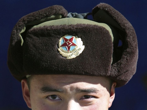  A Chinese soldier at the Nathu La mountain pass that connects Sikkim with Tibet. The Nathu La route to Mount Kailash was launched in 2015 and is the less arduous of the two possible routes to Mount Kailash                        