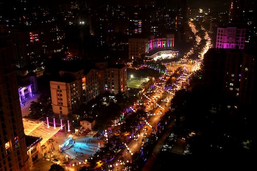  Cities like Mumbai, seen here, are a glittering sight during Diwali, with buildings and houses strewn with coloured lights for the festival.                                                