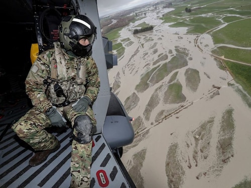  <p class="Default"><strong>New Zealand</strong><br /><br />A soldier looks out from a helicopter as they fly over the flood damage after heavy rains washed away bridges and cut roads in the Canterbury region, in New Zealand. June 1, 2021</p>