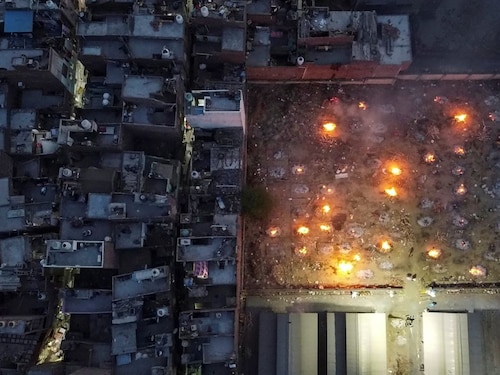  <p class="Body">A mass cremation of victims who died due to Covid-19, is seen in this ariel view of a crematorium ground in New Delhi, India, April 22, 2021. Picture taken with a drone.</p>