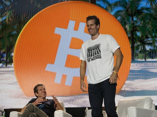  <p class="Body">Tyler Winklevoss and Cameron Winklevoss (L-R) creators of cryptocurrency exchange Gemini Trust Co. on stage at the Bitcoin 2021 event. Cameron&rsquos t-shirt captioned "Rage Against the Machine" with a picture of a Federal Reserve building made a point about cryptocurrency"s decentralised origin story, beyond the reins of any government or financial institution</p>