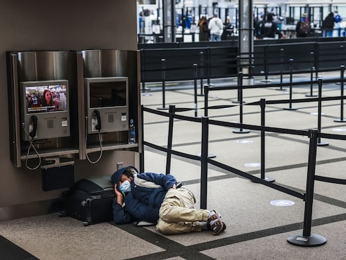  <p>A man takes a nap next to an empty security line at Denver International Airport on March 13, 2021, in Denver, Colorado. More than 1,800 flights into and out of Denver have been canceled this weekend as a winter storm is expected to bring two to four feet of snow to parts of Colorado.</p>