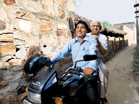 CHARGING UP: Memhood Khan's plans changed Ramzaan's life for the better. The young man treats Khan to a ride on his new motorcycle