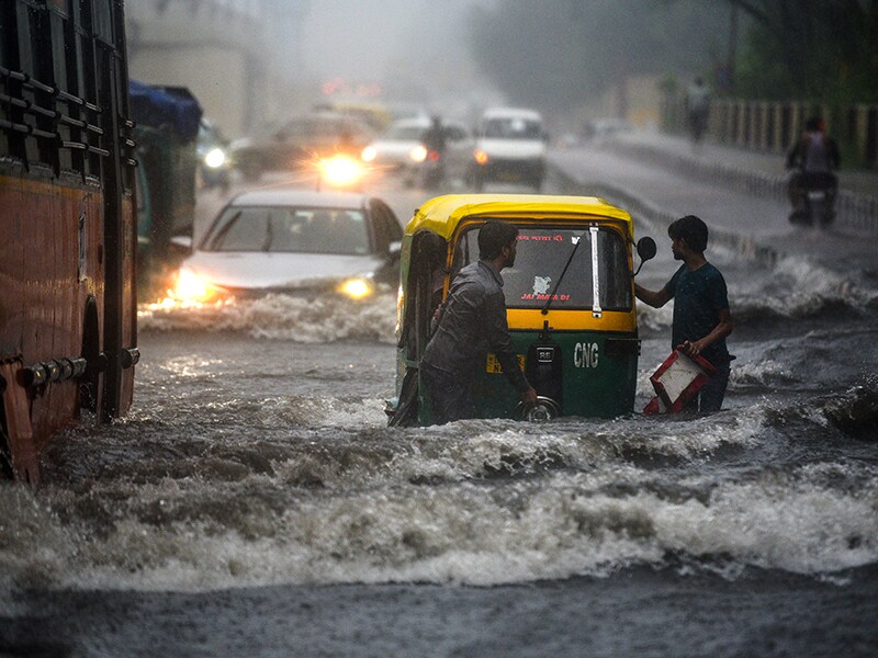 Photo of the day: Commuters battle water-logging in New Delhi