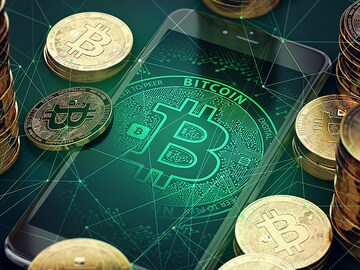 Bitcoin hits new record, with less talk of a bubble