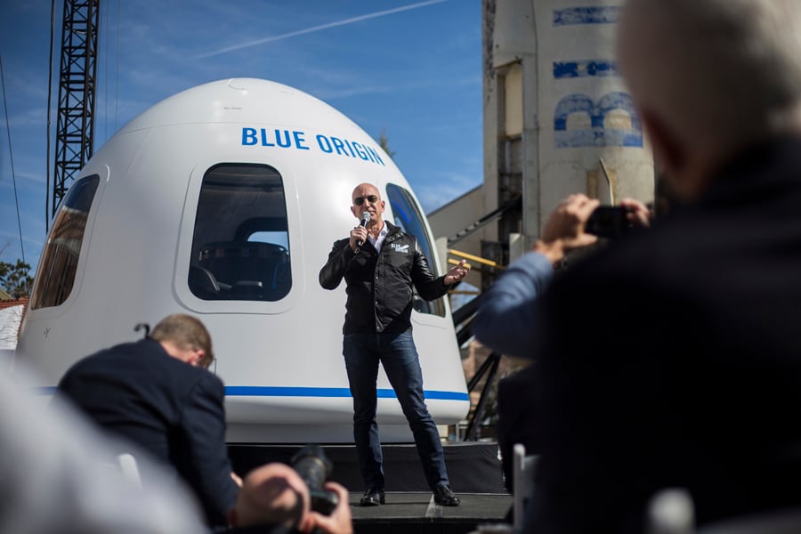 Bezos will fly aboard Blue Origin's first human trip to space