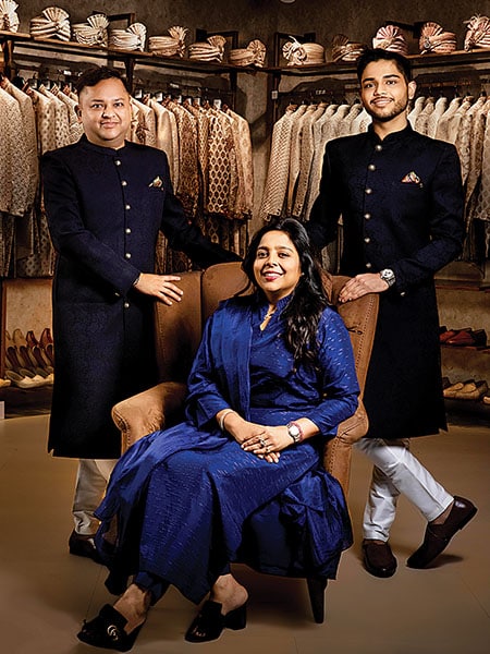 Modi with his wife Shilpi (seated) and son Vedant (right)