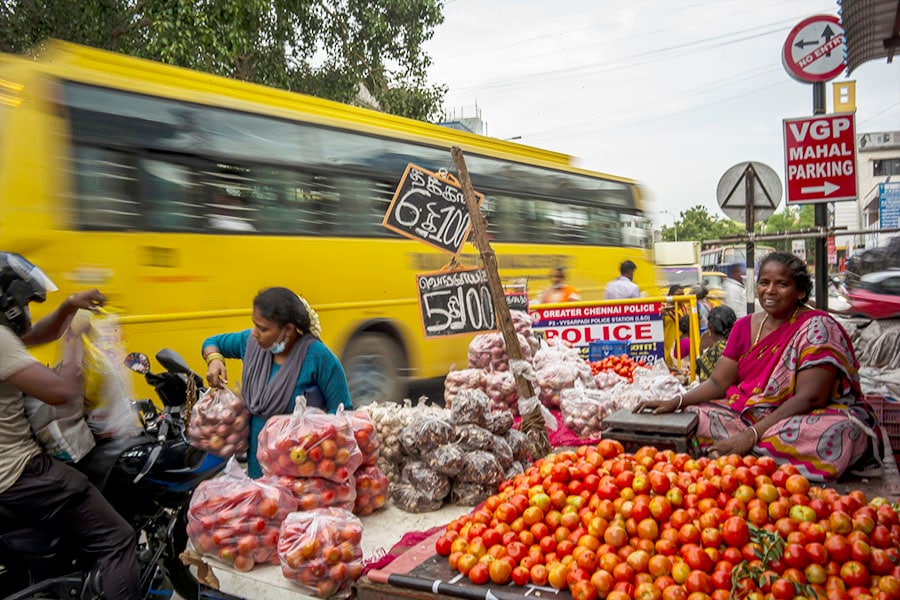 Produce hawker Amul Vasudevan, who was fined repeatedly for using throwaway bags, along a busy road in Chennai, India, July 7, 2022. India’s state of Tamil Nadu was not the country’s first to try to curtail plastic pollution, but unlike others it was relentless in enforcing its law. (Anindito Mukherjee/The New York Times)