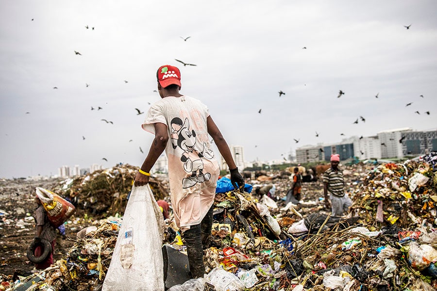 Produce hawker Amul Vasudevan, who was fined repeatedly for using throwaway bags, along a busy road in Chennai, India, July 7, 2022. India’s state of Tamil Nadu was not the country’s first to try to curtail plastic pollution, but unlike others it was relentless in enforcing its law. (Anindito Mukherjee/The New York Times)