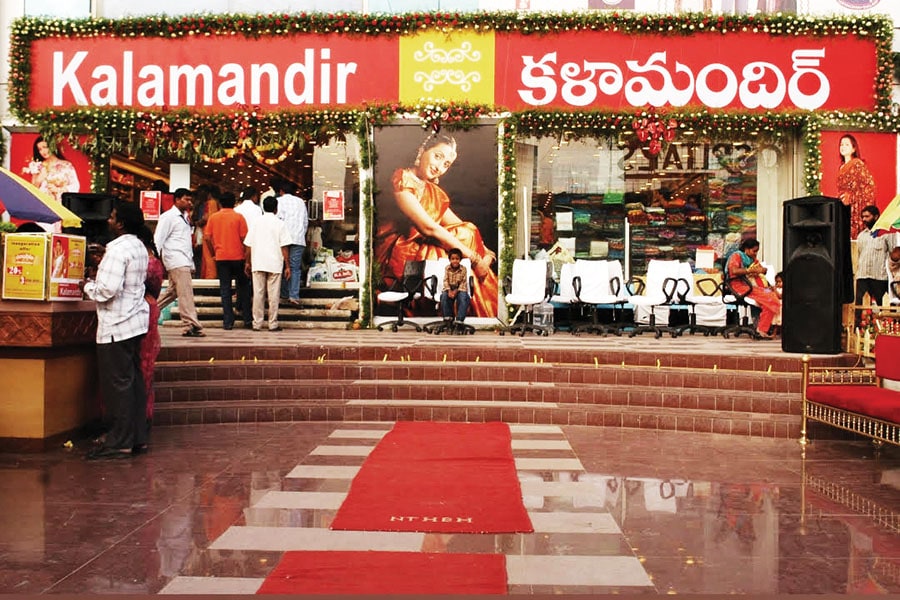 Team Sai Silks (Kalamandir), from left: Durgarao Chalavadi, whole-time director, head operations (Karnataka); Kalyan Srinivasa Annam, whole-time director & head of advertisement projects; Venkata Rajesh Annam, senior VP-operations (Andhra Pradesh); RB Bharadwaj, senior VP-IT & ecommerce; Mohan Chalavadi, senior VP-operations (Telangana); Jhansi Rani (seated), head-retail;  Annam Subash, head of sourcing; Prasad Chalavadi, founder & managing director Image: Vikas Chandra Pureti for Forbes India