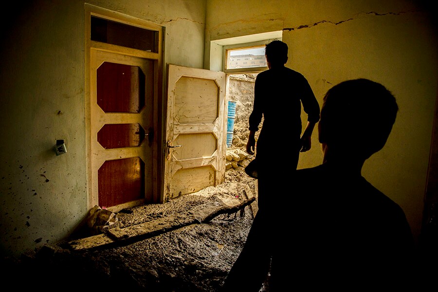 Mud inside the corridor of Saeed, 26, and his family, after a flash flood in Shinwari, eastern Afghanistan, on Aug. 17, 2022. Widespread flash floods have left more than 40 dead and 100 others injured in recent days in Afghanistan, battering a country already reeling from an economic crisis, terrorist attacks and other natural disasters. (Kiana Hayeri/The New York Times)