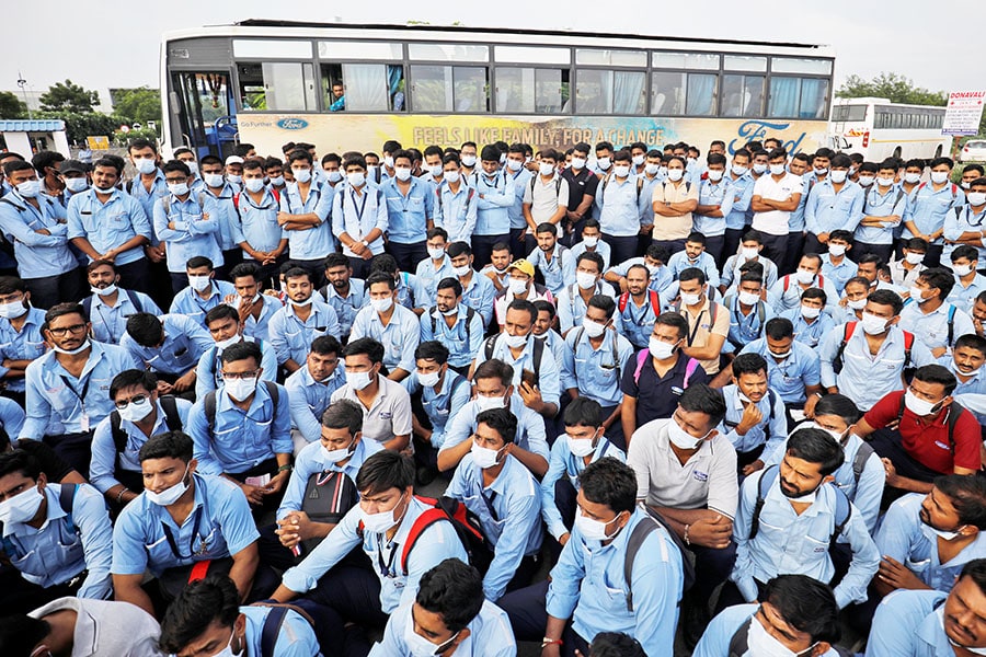 A file photo of workers of Ford Motor Co. gathered outside Ford's car assembly and engine-making facility in Sanand, Gujarat, India,  on September 21, 2021. Image: Amit Dave / Reuters

