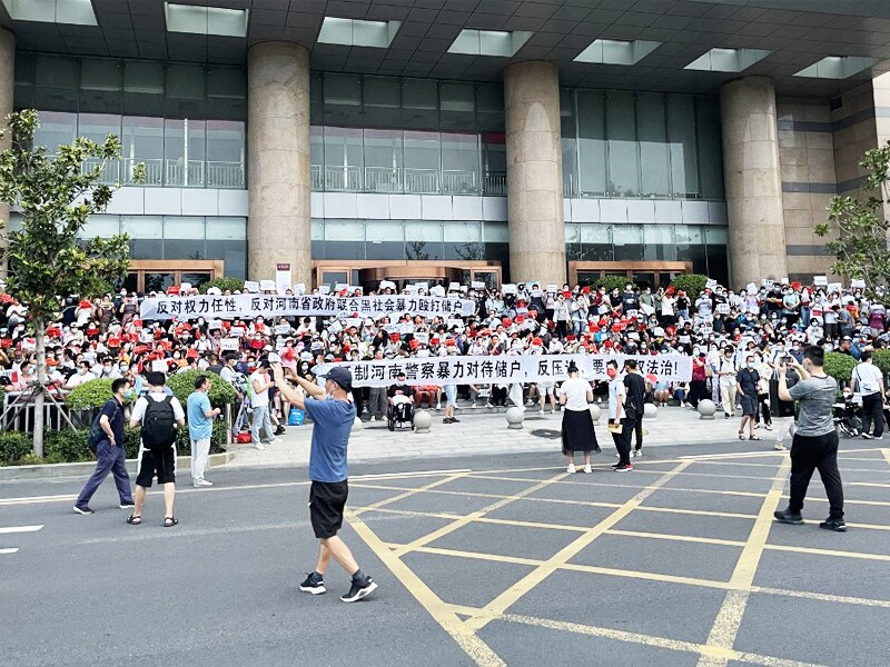 China arrests hundreds over banking scandal that sparked rare protests