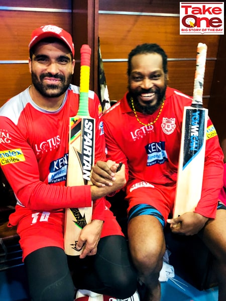 At the height of his career graph, Punjab Kings player Manzoor Dar (L) poses for a picture with his teammate, the legendary West Indies cricketer Chris Gayle after an IPL match in 2018.
Image: Courtesy Manzoor Dar