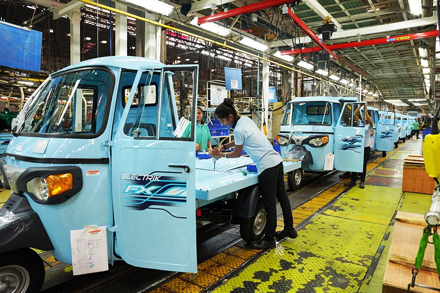 Women are working on the shop floor and putting together three-wheelers at breakneck speed at the Italian automaker Piaggio’s factory.
Image: Mexy Xavier