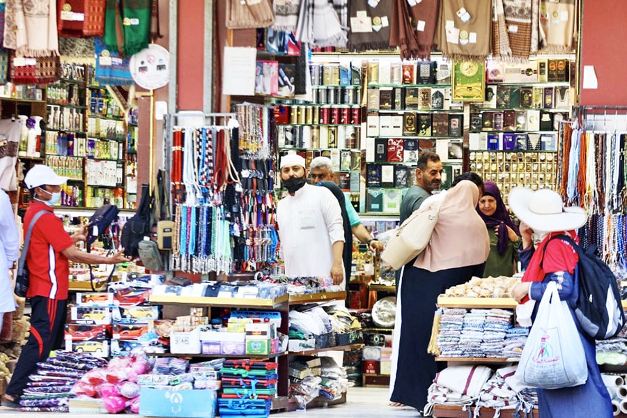 Muslim pilgrims shop in the market in the holy city of Mecca on July 4, 2022, as Saudi Arabia hosts some one million people, including 850,000 from abroad, for the hajj pilgrimage, a key pillar of Islam that all able-bodied Muslims are required to perform at least once in a lifetime. Credit: AFP